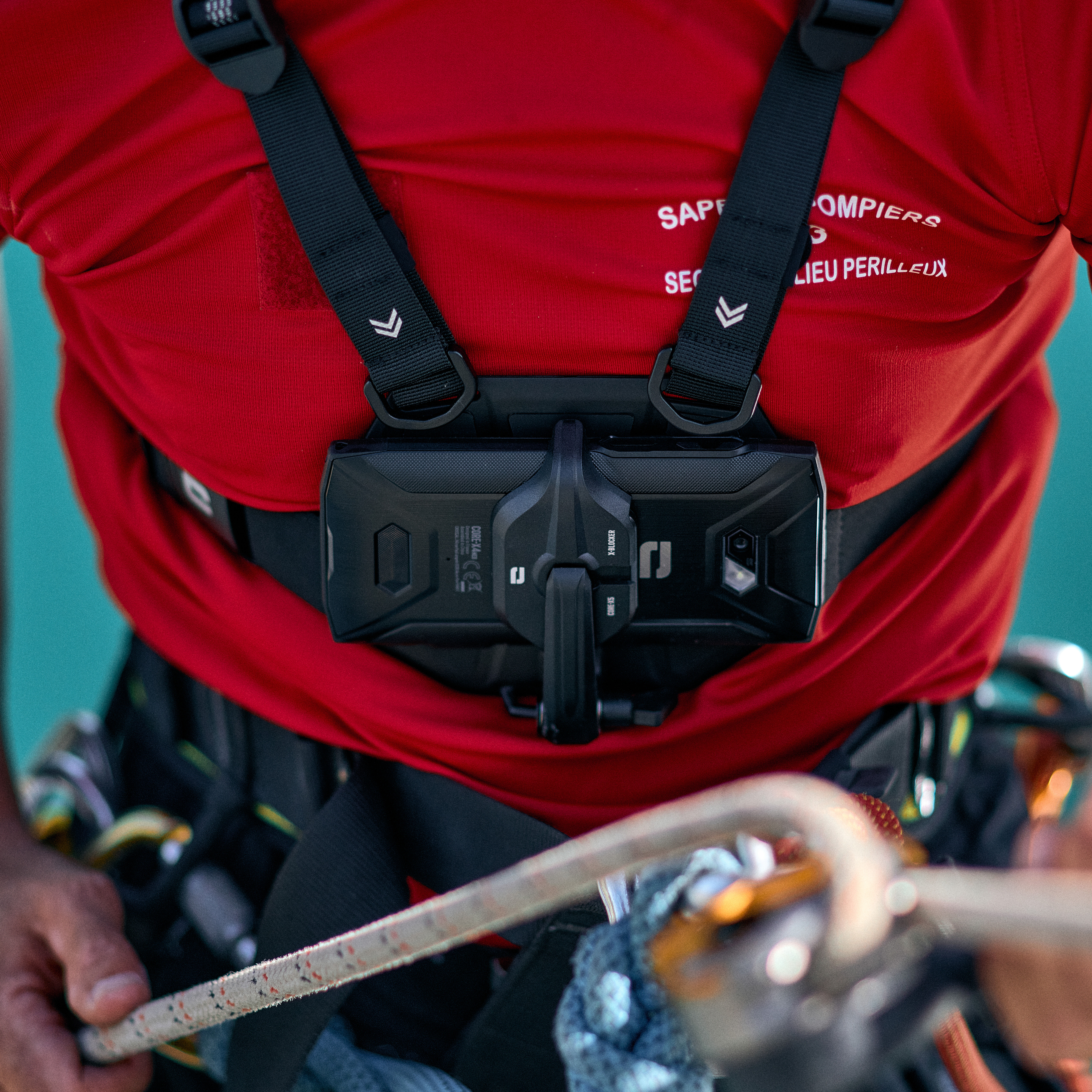 Firefighter with Crosscall smartphone and X-CHEST attachment